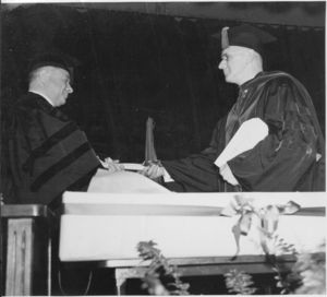 Suffolk University President Gleason L. Archer presenting honorary degree to David Sarnoff, President of RCA, at the 1939 commencement
