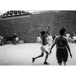 Women playing volleyball.