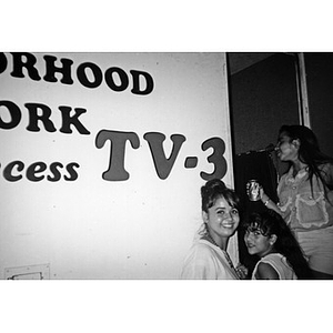 Three teenage girls at a public access television station.