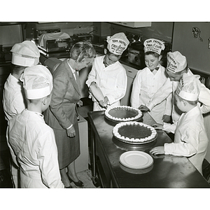 Members of the Tom Pappas Chefs' Club decorate pies in the Sheraton Plaza Hotel testing kitchen