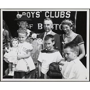 Three judges pose behind Miss South Boston and her brother during a Boys' Club Little Sister Contest