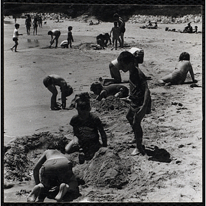 Children play in the sand on a beach