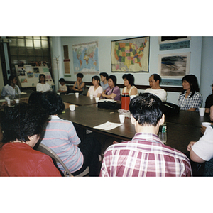 Unidentified Association members hold a meeting