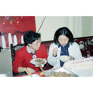 Guests eating at an International Women's Day event