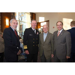 President Aoun poses with three men at the Veterans Memorial dedication ceremony