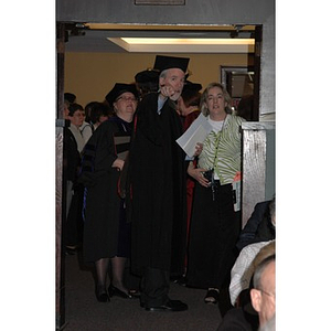 Faculty member speaks to usher at School of Nursing convocation