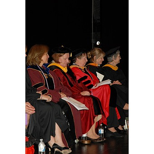 School of Nursing administration and faculty seated onstage during convocation