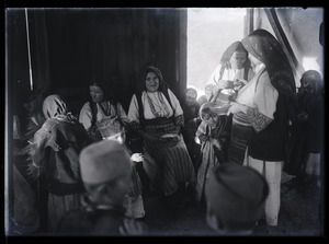 Women and children seated in a room