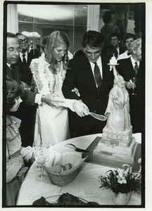 Andrew Stein and Lynn Forester cutting wedding cake