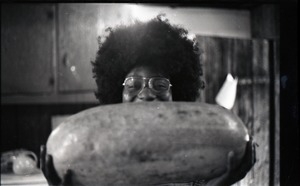 Sylvia Jordan with watermelon in commune kitchen