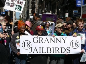 Granny Jailbirds marching with their banner, protesting the War in Iraq