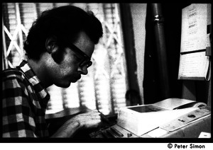 Unidentified man working at a typewriter