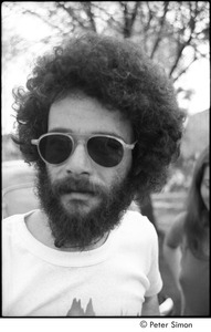 Ram Dass retreat at David McClelland's: portrait of a man with a beard and sunglasses