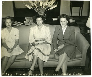 American Red Cross workers on a sofa