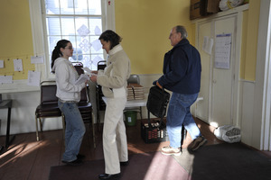 Aftermath of the Congregational Church fire in West Cummington, Mass.: parishioners gathering in the foyer of the Parish House