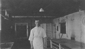 William J. Fahey, Jr. standing in Massachusetts Agricultural College bakeshop