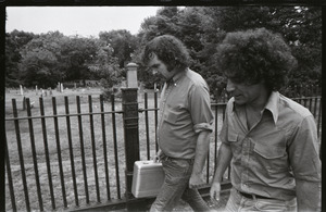 Abbie Hoffman and George Kimball walking past a cemetery (Garden Street side of Old Burying Ground)