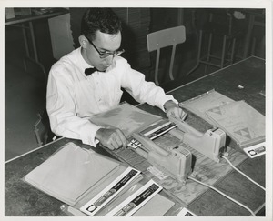 Man packaging sandpaper