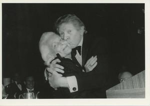 Margaret Milbank Bogert being kissed by Danny Kayer at CAD dinner