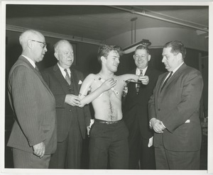 William Anderson demonstrates his arm prosthetics