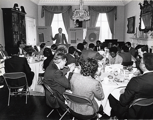 Mayor Raymond L. Flynn discussing Federal funding at a meeting with unidentified people