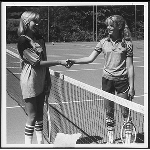 Youth shaking hands on tennis court at Pleasant Valley camp