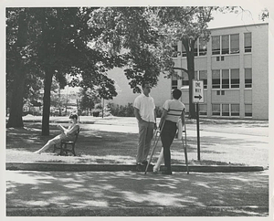 Students standing on a street corner before Schoo-Bemis Science Center