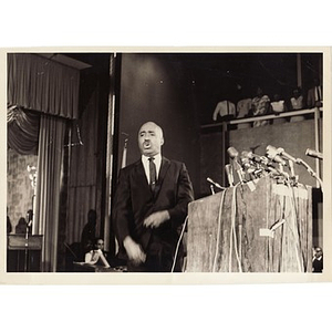 Reverend Laymon Hunter speaks behind a podium