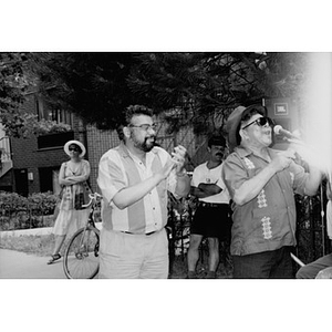 Musician at a microphone outside.