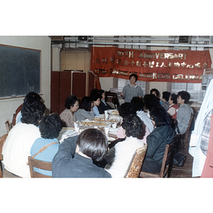 Woman speaks at Garment Workers Celebration