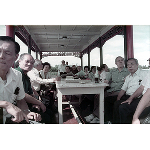 Chinese Progressive Association members, including Henry Wong and You King Yee, at a pavilion in China