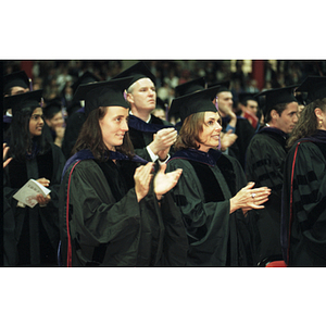 School of Law graduates clapping at the commencement ceremony for the Class of 1997