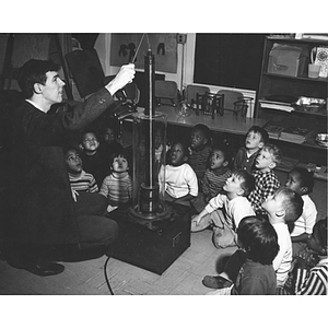 Education co-op Paul Gavin, left, gives a science demonstration at the Dorchester Community Center