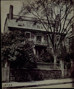 Exterior view of the Hancock House with two women standing on balcony, Boston, Mass., undated