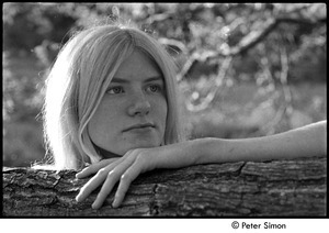 Karen Helberg posing over tree branch