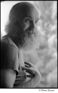 Ram Dass: half-length portrait in tee-shirt while at the Rowe Center spiritual retreat