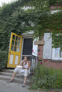 Hungry Ghost Bread: owner Jonathan C. Stevens seated on the front steps of the bakery