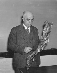 John Lentz standing indoors, instructing Veterinary Science Class