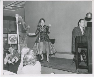 Woman singing on stage