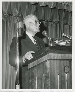 Dr. Salvatore DiMichael speaking on stage at Institute Day