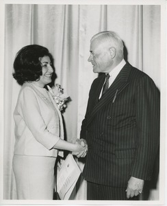 Hermann G. Place and unidentified young woman on stage at Institute Day