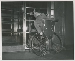 Client in wheelchair entering ICD building