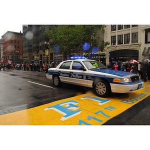 Boston Police Department vehicle crossing finish line at "One Run" event in Boston (May 2013)