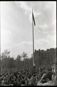 Demonstration at State House against the killings at Kent State: protesters surrounding and attempting to lower the American flag