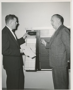 Willis C. Gorthy and an unidentifed man using a chart board at an ICD field workshop