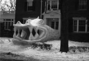 Dragon snow sculpture in front of Beta Theta Pi Fraternity House, 1956