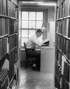 Student studying in Stetson Library stacks