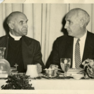 Alan Guttmacher with a priest