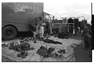 Fair Day at Castlewellan, Co. Down. Women try on shoes at the open air market and other general scenes from the market