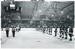 Team listening to national anthem